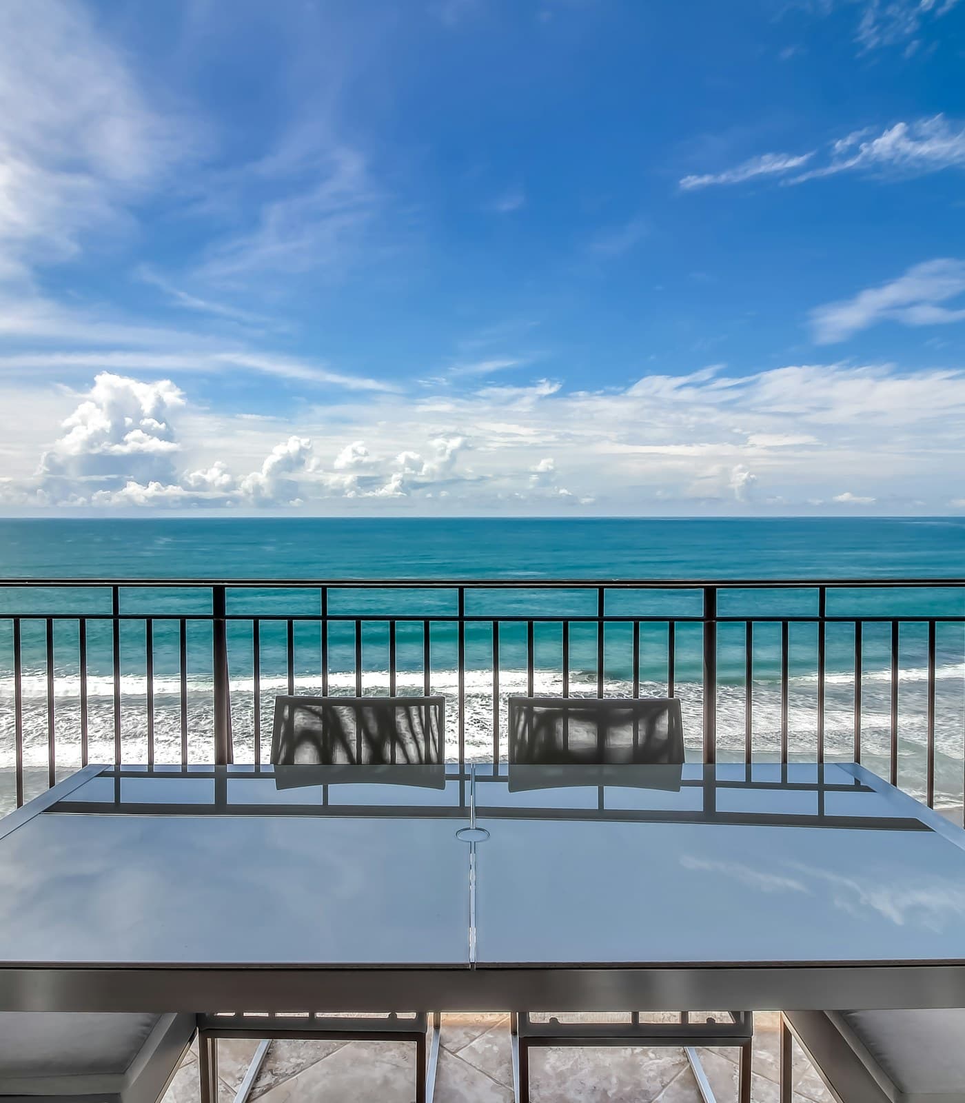 The balcony at Vista las Palmas 10C in Jacó, ten floors up, looking out over the Pacific